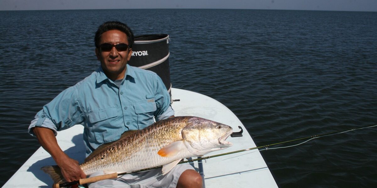 Boni Galan’s first Redfish on Fly! 27lbs.